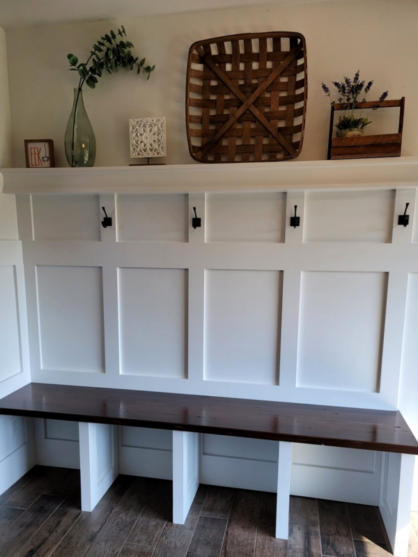 Shaker Panel wall with coat hooks Built-in mudroom bench with board-and-batten paneling and a reclaimed pine seat, custom built in West Michigan
